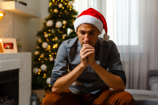 sad man in santa hat